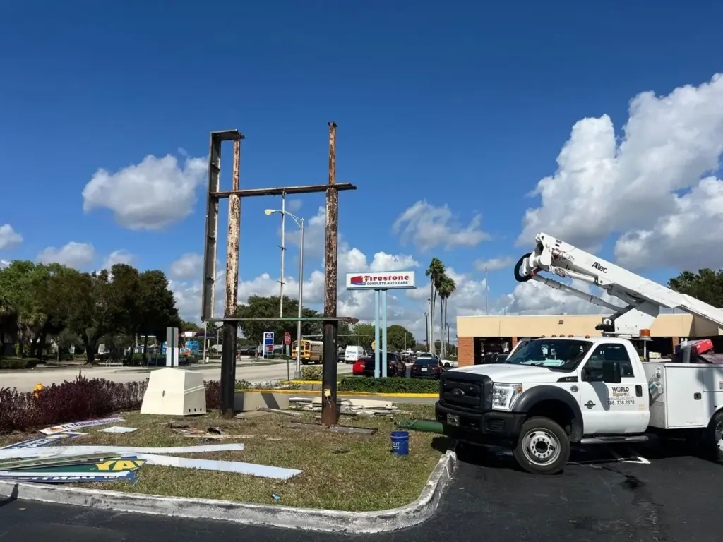 Old Miller Plaza pylon frame being removed